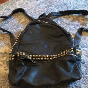 Gray leather backpack with studs
